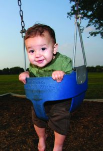Toddler in swing