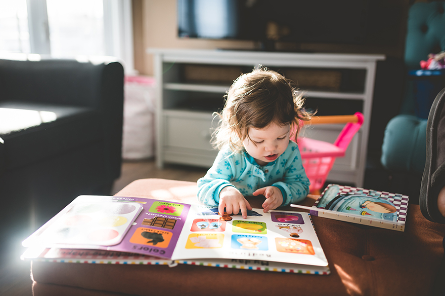 toddler looking at book