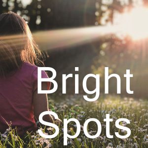 Bright spots image - photo of girl facing sun in nature
